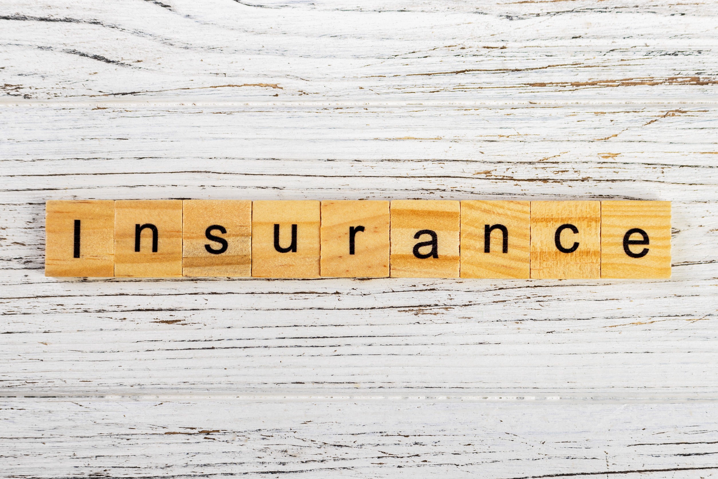 Wooden letter tiles arranged in a row spell out the word 